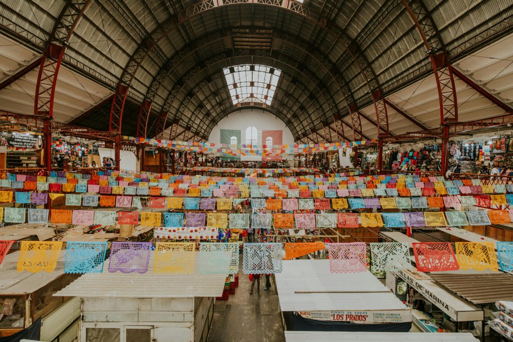 Colorful paper banners adorn the bustling Mercado Hidalgo in Guanajuato, Mexico.